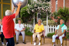 Instructor working with senior ladies in a gym